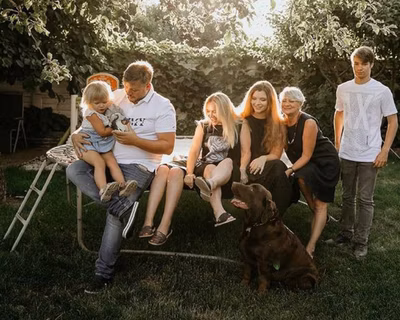 Image of Volodymyr Zhukov (right) with his family at home in Kyiv, Ukraine.