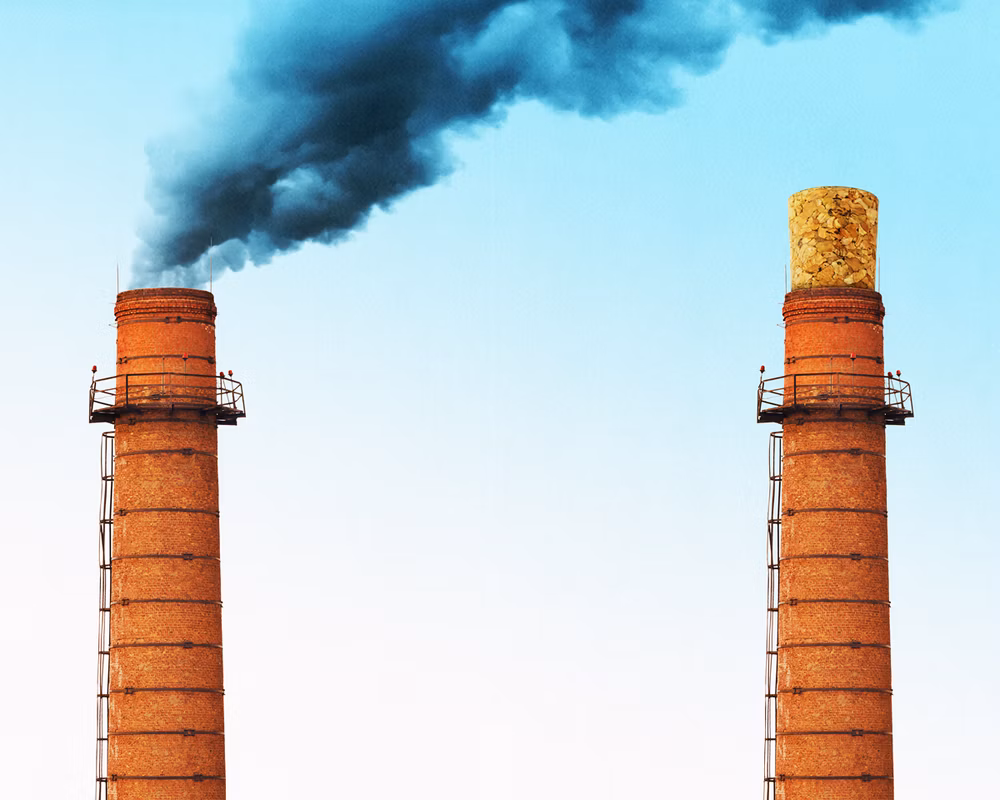 Opener spread photo of smoke stack polluting the sky on left and duplicate smoke stack to the right of it with a cork on top (no pollution).